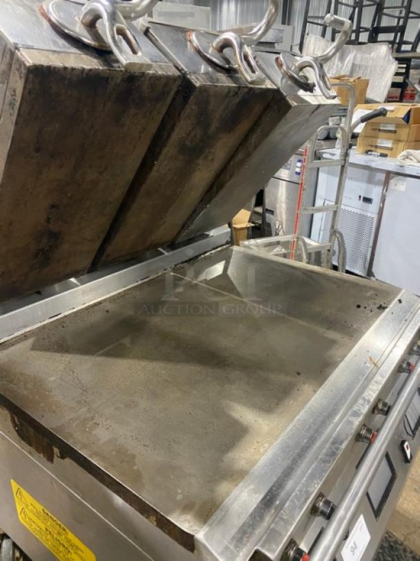 Taylor Model L81122 commercial griddle, stainless steel, triple platen, 36" dual-sided, programmable controls, on casters.