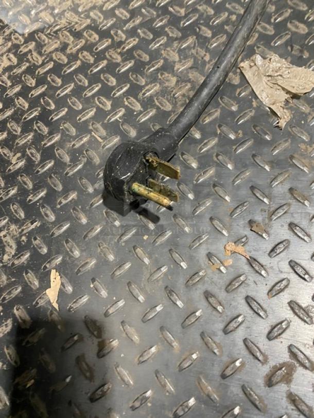 TurboChef oven power plug, three-pronged, for 2014 TurboChef NGO model, 208/240V, on a metal surface.