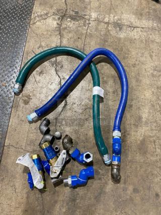 Dormont commercial gas connectors, assorted. Includes two flexible hoses and various fittings. Used condition, visible wear.
