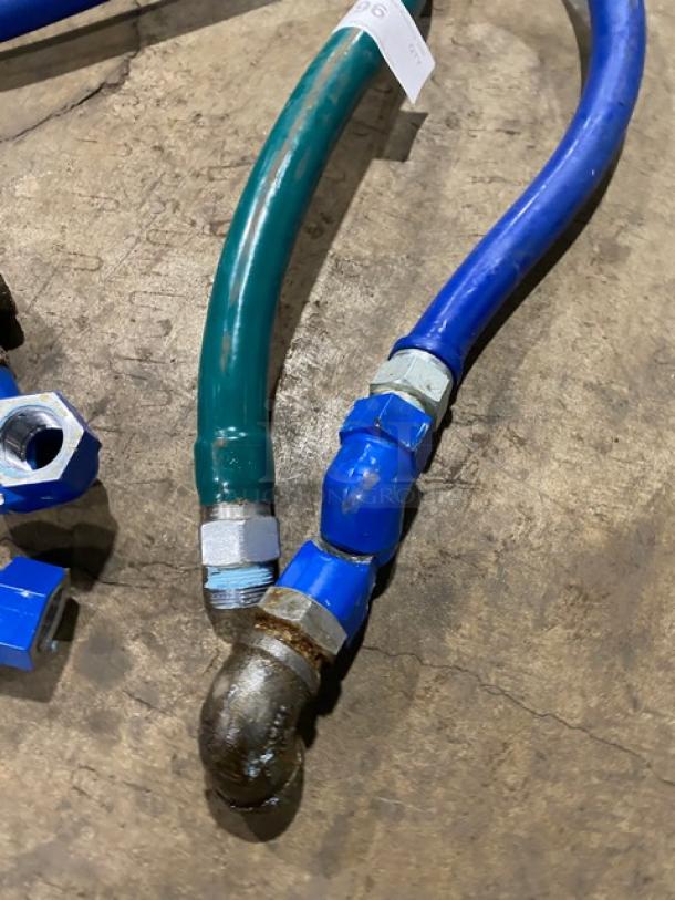 Dormont commercial gas connectors, assorted colors, with metal fittings. Appears used, showing some wear.