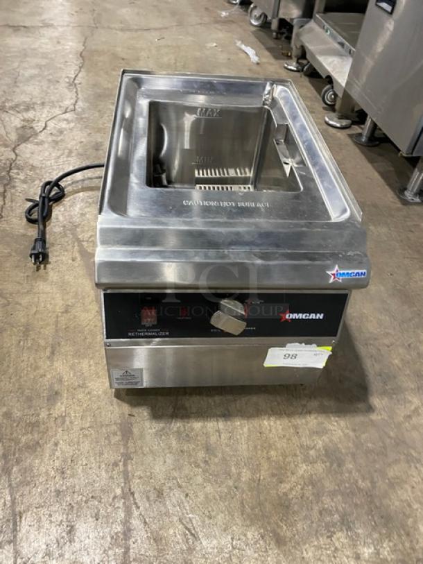 Omcan stainless steel electric pasta cooker, model 41882, with basket holder and mesh basket, 240V, excellent condition.