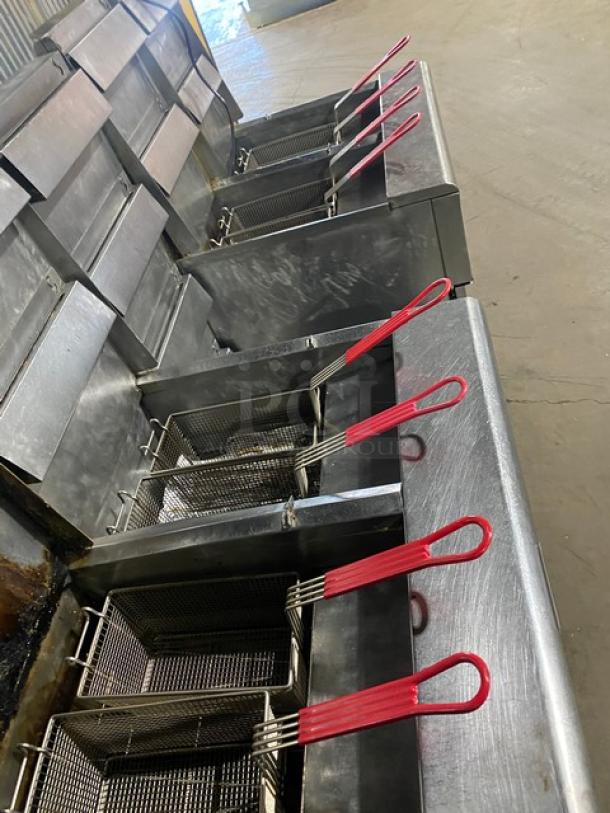 Frymaster FMPH455SC 4-bay stainless steel fryer system with center dump station, basket hangers, digital control, and oil filter.