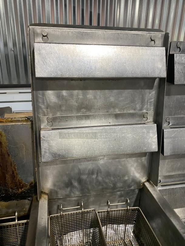 Frymaster FMPH455SC commercial stainless steel 4-bay fryer system with center dump, basket hangers, and digital control.