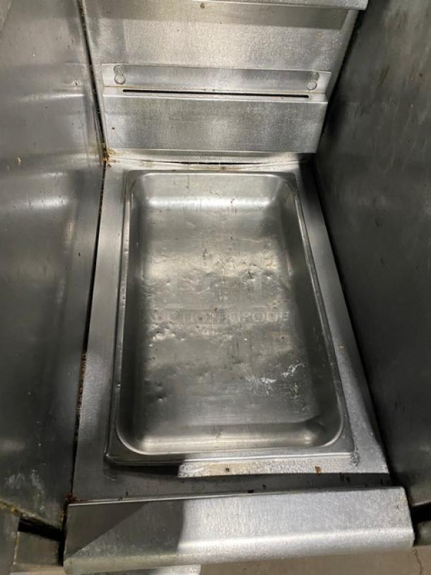 Frymaster 4-Bay Fryer System center dump station, stainless steel, with backsplash, model FMPH455SC, on casters.