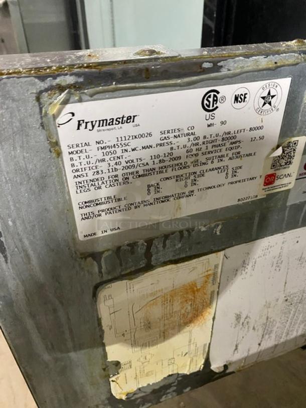 Frymaster stainless steel 4-bay deep fryer, model FMPH455SC. Features digital controls, oil filter, center dump station, and casters. Serial number: 1112IK0026.