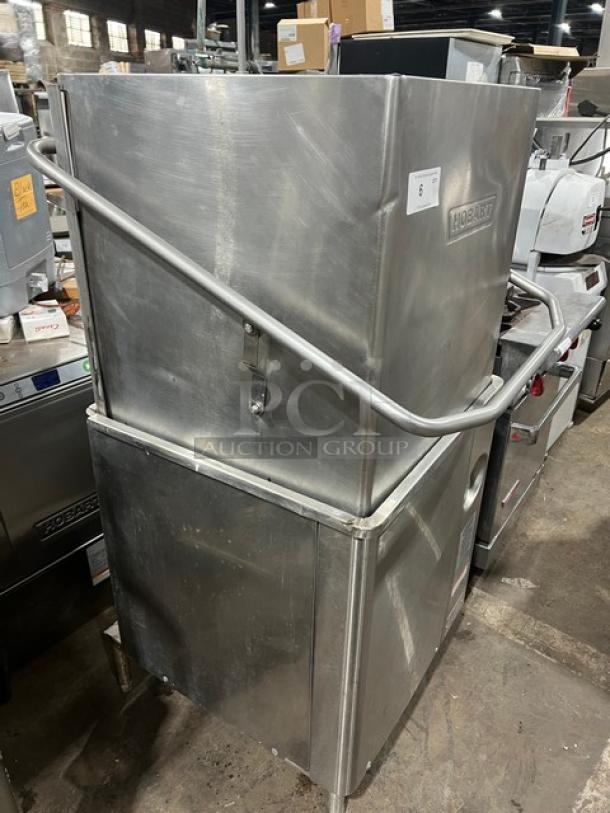 Hobart AM15 stainless steel ventless door-type dishwasher, electric-powered, commercial-grade, on legs, used condition.