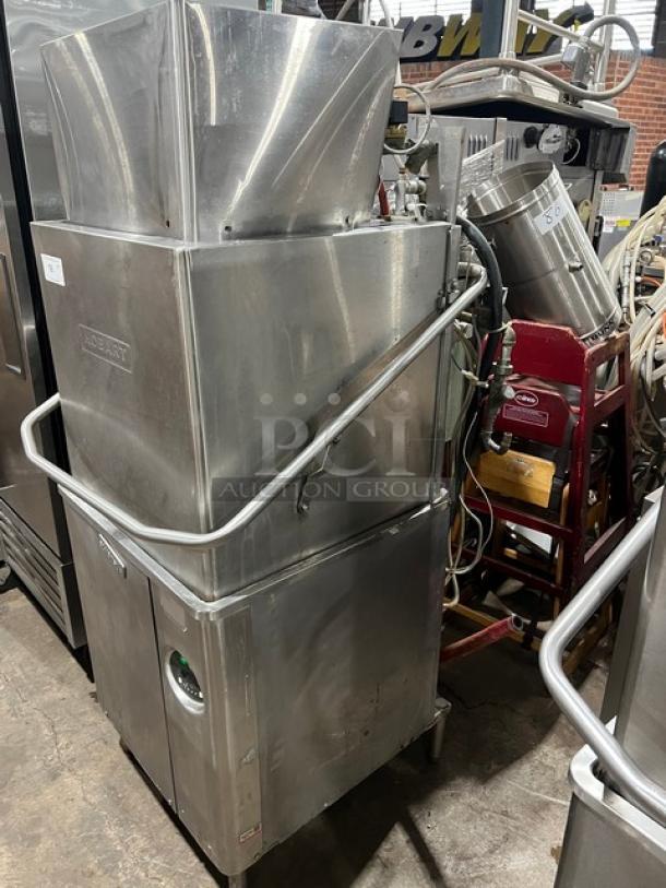 Hobart Advansys Series commercial stainless steel door-type dishwashing machine on legs, used condition, visible Hobart branding.
