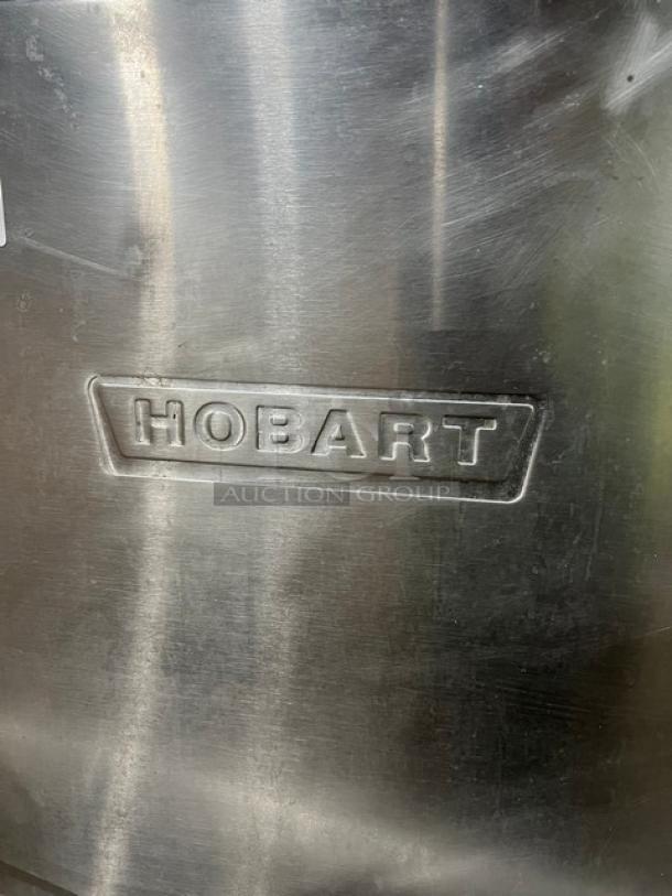 Hobart Advansys commercial stainless steel dishwashing machine, electric, door-type, on legs. Logo visible.