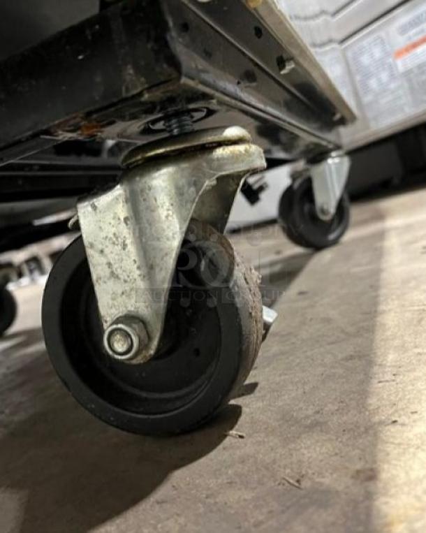 True T-23F Commercial Freezer on casters close-up, showing poly coated wired rack and Energy Star certification label.