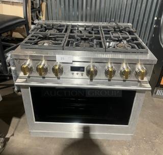 Monogram stainless steel gas range, 6 burners, oven combo, wired rack, on legs, excellent condition.