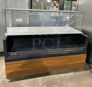 Structural Concepts refrigerated merchandiser, model SBZ6652DR, black finish, enclosed glass top, rear sliding doors.