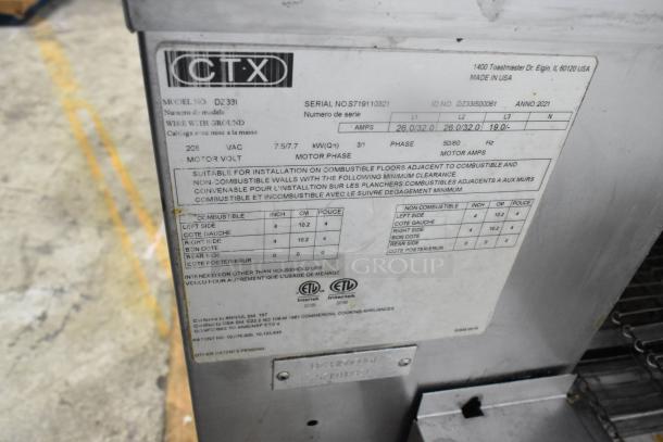 Close-up of label on 2021 Middleby Marshall CTX DZ33I stainless steel commercial electric conveyor pizza ovens, showing model and electrical specs.