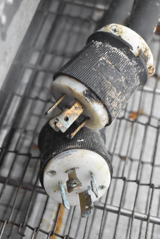 Two Middleby Marshall CTX DZ33I conveyor pizza ovens, stainless steel, on casters. Commercial electric, 208V, 3/1 phase. Visible power plugs.