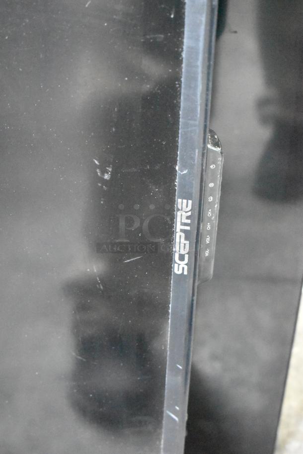 Three televisions including a Sceptre model, visible controls, black casing, moderate wear, pickup required.