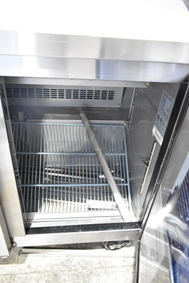 Dukers commercial prep table with mega top, stainless steel, bain marie on casters, 115V, 1 phase, shows internal shelving.