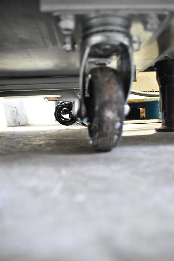 2024 Coldline UC-27R undercounter cooler on commercial casters, visible from underneath. 115V, 1 Phase.