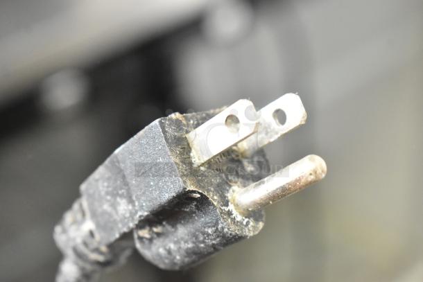 Dirty power plug of a Coldline ICE80-HA commercial ice machine, 115 volts, 1 phase connection.