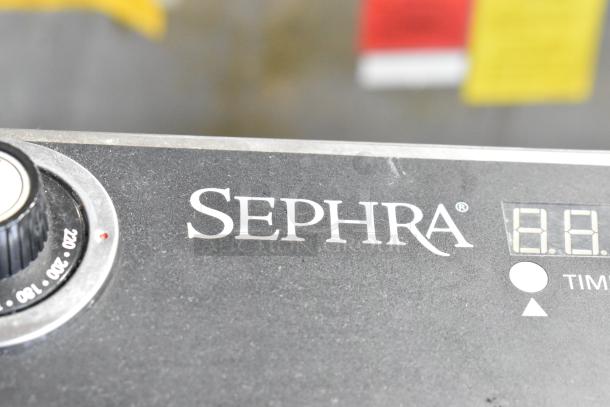 Sephra SEMANWB countertop waffle maker, 120V, digital timer display, excellent condition, branded panel view.