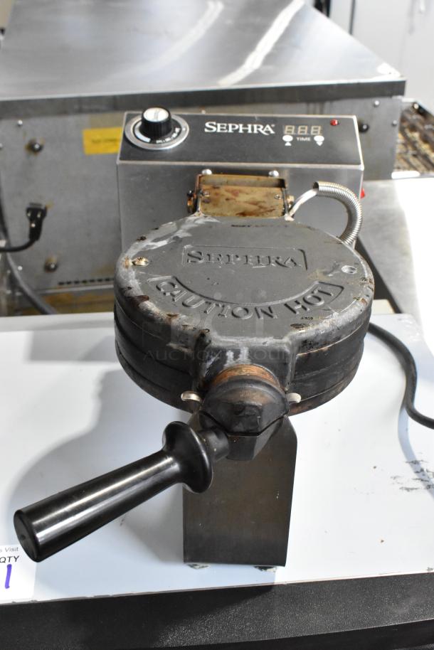 Sephra SEMANWB countertop waffle maker, 120 volts, used condition. Features Sephra branding and control panel.