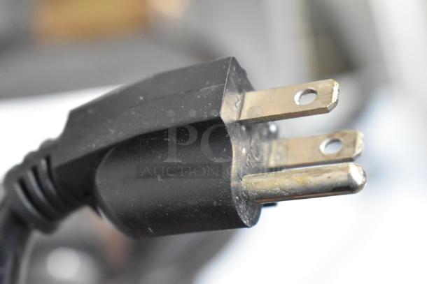 Close-up of a three-pronged plug for a Sephra SEMANWB countertop waffle maker, 120 volts, 1 phase.