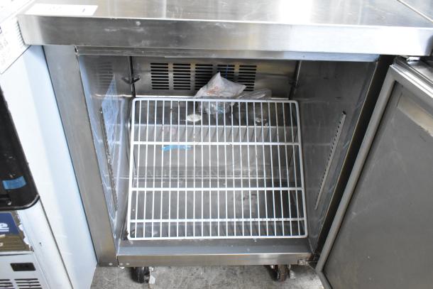 2024 Coldline UC-27F undercounter freezer with single door, on casters. Good condition with visible interior racks. 115V, 1 Phase.