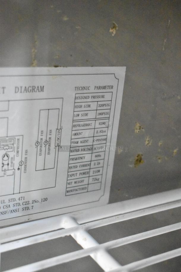 Label inside 2024 Coldline UC-27R cooler showing technical parameters like pressure, refrigerant type, and voltage specs.