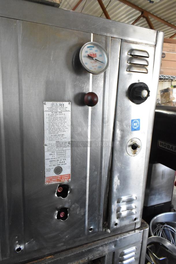 Bari M54S commercial pizza oven, natural gas, single deck, metal legs, cooking stones, 80,000 BTU, control panel visible.