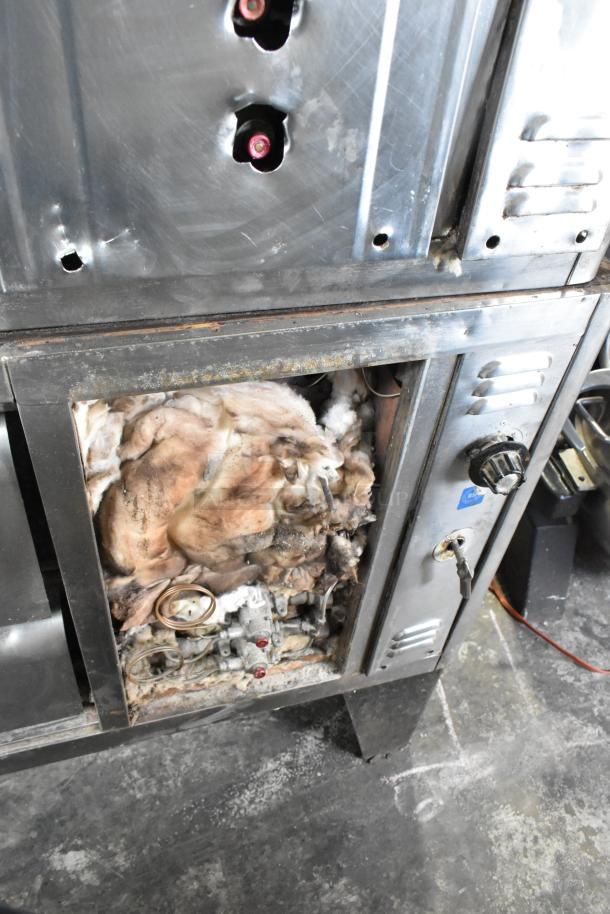 Bari M54S commercial single deck pizza oven, natural gas, cooking stones, metal legs, 80,000 BTU, visible internal components.