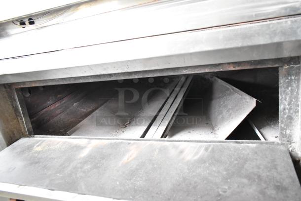 Bari M54S commercial gas pizza oven with cooking stones, single deck, metal legs, 80,000 BTU, visible wear.