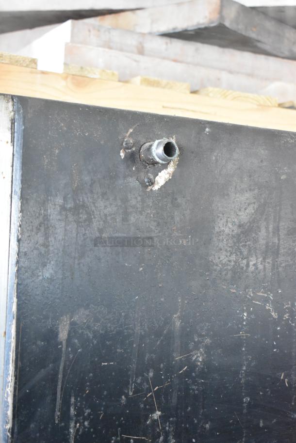 Alt text: Bari M54S commercial pizza oven, natural gas, single deck, cooking stones, metal legs, 80,000 BTU, visible wear.