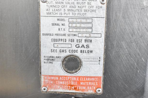 Bari M54S pizza oven label showing model, serial number 932, 80,000 BTU, natural gas equipped, with safety instructions.