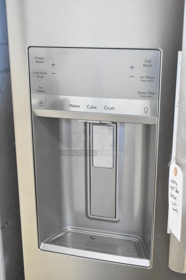 Frigidaire GRMS2773AF03 French Door refrigerator with ice and water dispenser, stainless finish, excellent condition.