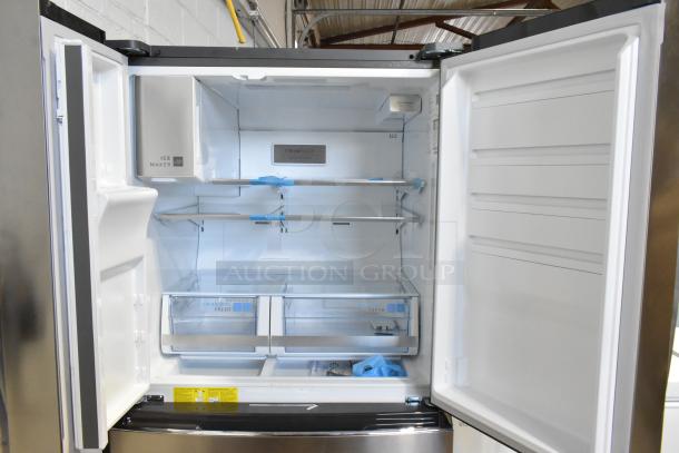 Frigidaire GRMS2773AF03 26.3 cu. ft. French door refrigerator with freezer, features ice maker, shelves, and crisper drawers.
