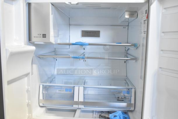 Frigidaire GRMS2773AF03 26.3 cu. ft. French Door Refrigerator with freezer, ice maker, and TwinTech cooling system.