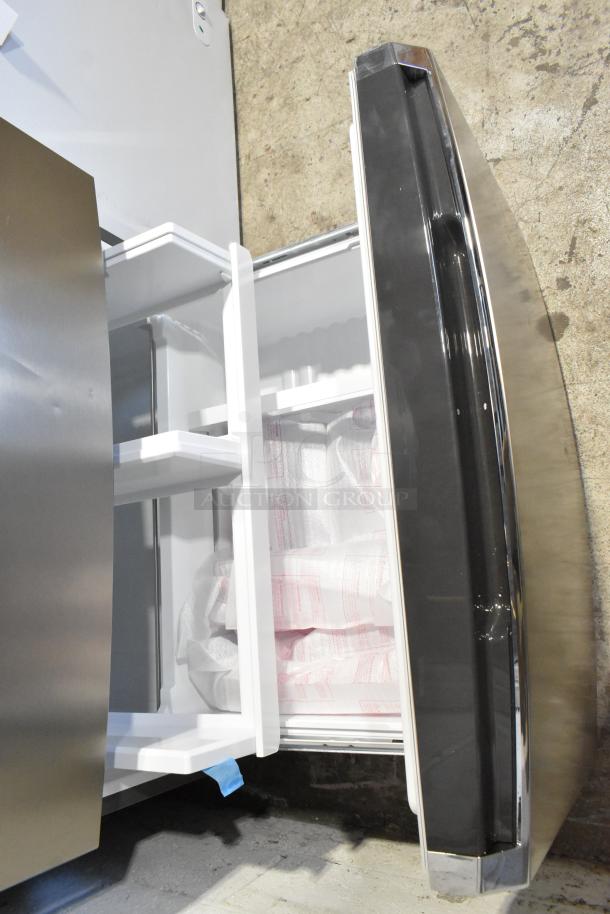 Frigidaire GRMS2773AF03 French door refrigerator, 26.3 cu. ft., open freezer view, sleek design, 115 volts, 1 phase.