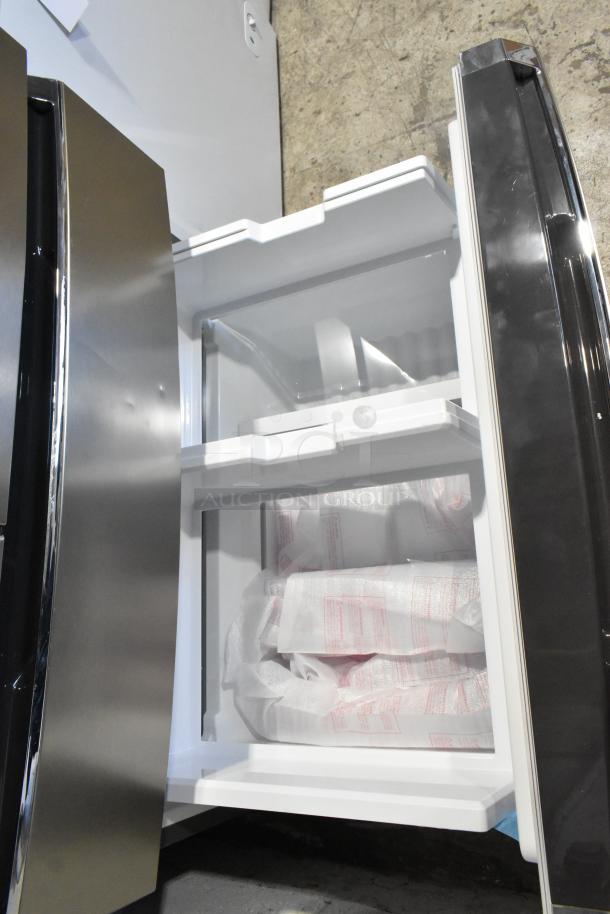 Frigidaire GRMS2773AF03 26.3 cu. ft. French door refrigerator with freezer, new condition, interior view showing spacious storage.