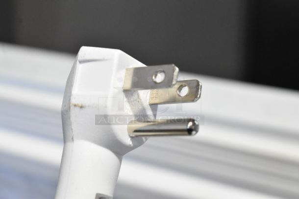 Close-up of power plug for Vissani HMCF7W5 chest freezer, showing three-prong design.