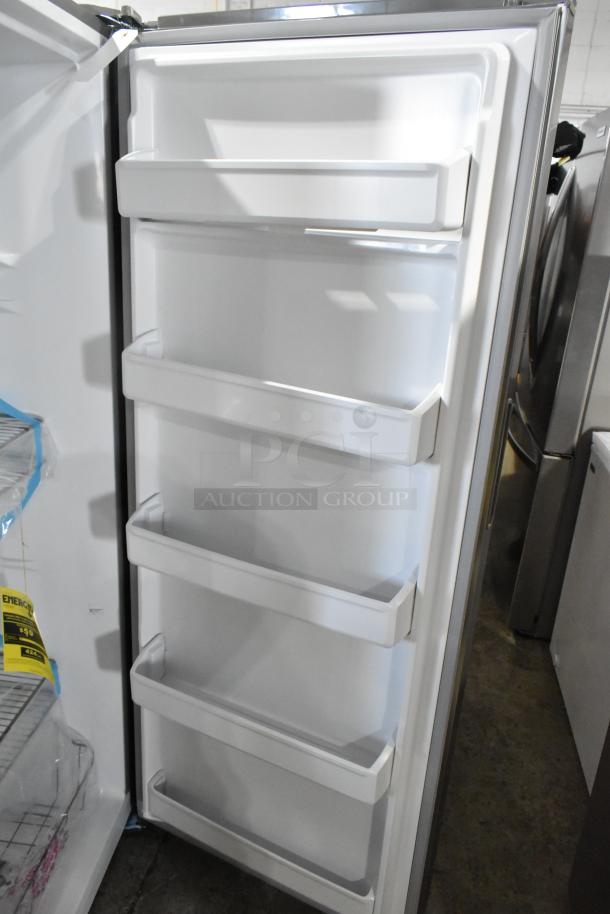 Frigidaire FFFU13F2VV Upright Freezer, 13.0 cu. ft., shown open with multiple door shelves, excellent condition.