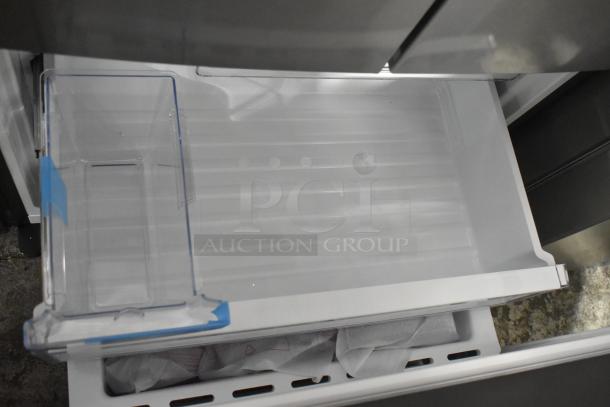 2025 Frigidaire FRFG1723AV04 French door cooler with freezer, clean interior, visible storage bin, 115V, 1 phase.