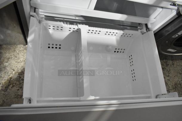 Brand new Frigidaire GRFS2853AFL French door cooler with visible freezer compartment; 115V, 1 Phase; minor scratches.