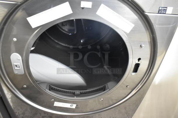 2025 Samsung DVE45B6300P 27" electric dryer, stainless steel, 7.5 cu. ft. capacity, visible label, open drum view.