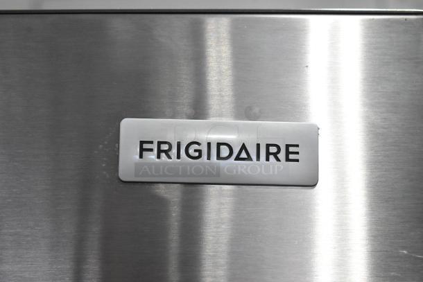 Close-up of Frigidaire logo on stainless steel surface of the 2025 Frigidaire FFTR1835VSC Reach-In Cooler with Freezer.