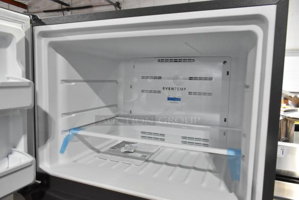 Brand new Frigidaire FFTR1835VSC reach-in cooler with freezer, 115V, 1-phase. Interior view showing adjustable shelving.