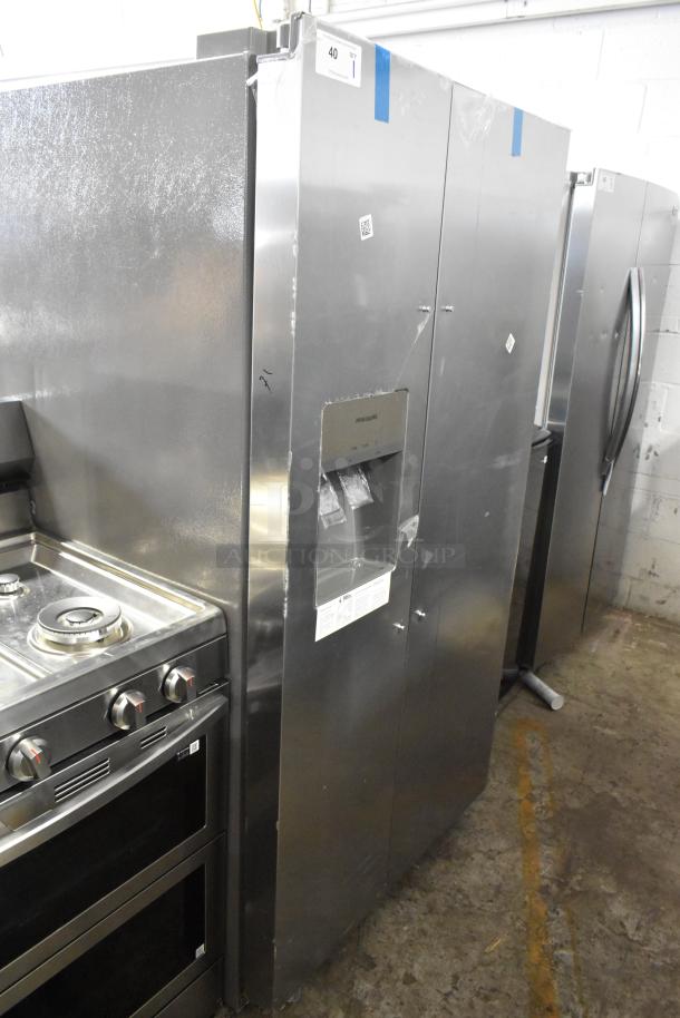 Frigidaire FRSS2623ASM cooler w/ freezer, stainless steel, 115V, 1 phase. New with scratches, tags visible.