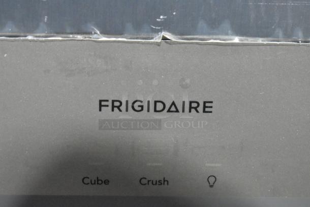 Brand new Frigidaire FRSS2623ASM cooler with freezer, scratch and dent, 115V, 1 phase, logo and controls visible.