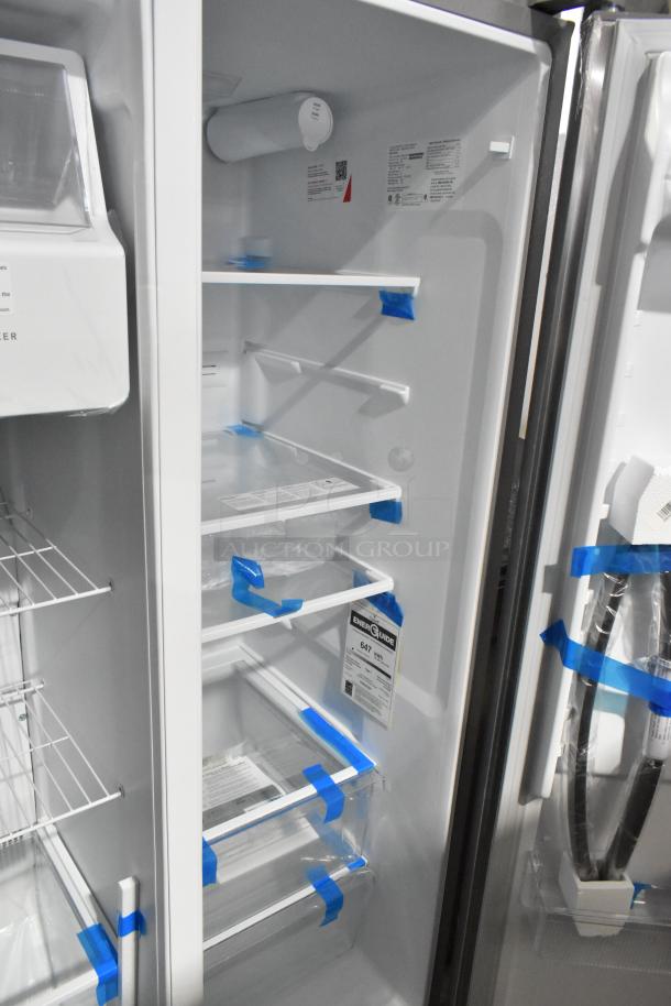 Brand new Frigidaire FRSS2623ASM cooler with freezer, 115 volts, 1 phase, scratch and dent, interior shelves shown.