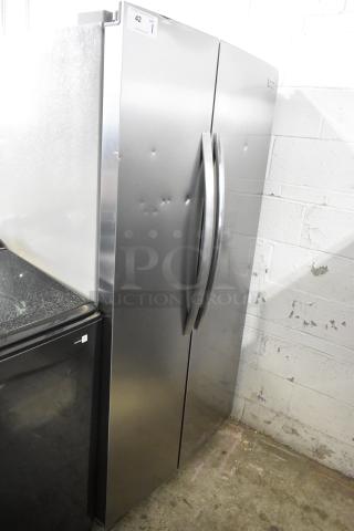 Brand new Frigidaire SEE26NVDDA cooler/freezer, 115V, 1 phase. Scratch and dent, stainless steel, visible bumps.