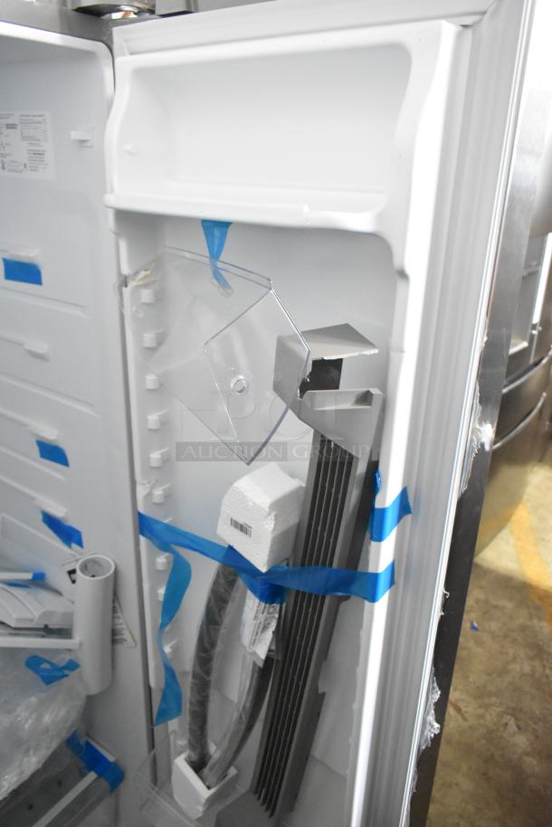 Brand new Frigidaire FRSS2623ASN cooler with freezer, showing interior packaging. 115V, 1 Phase, minor exterior scratches.