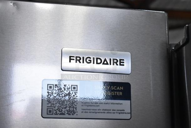 Brand new Frigidaire FRFG1723AV04 cooler with freezer; minor scratches. Visible brand label and registration QR code.