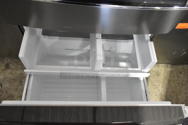 Brand new Frigidaire Gallery GRMS2773AF01 French Door fridge, stainless steel, scratch and dent, with open freezer drawers.